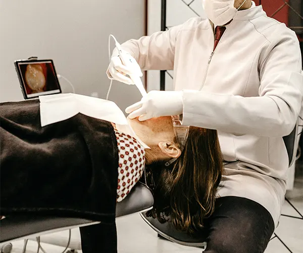 dentist providing emergency dental treatment