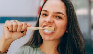 a women brushing her teeth