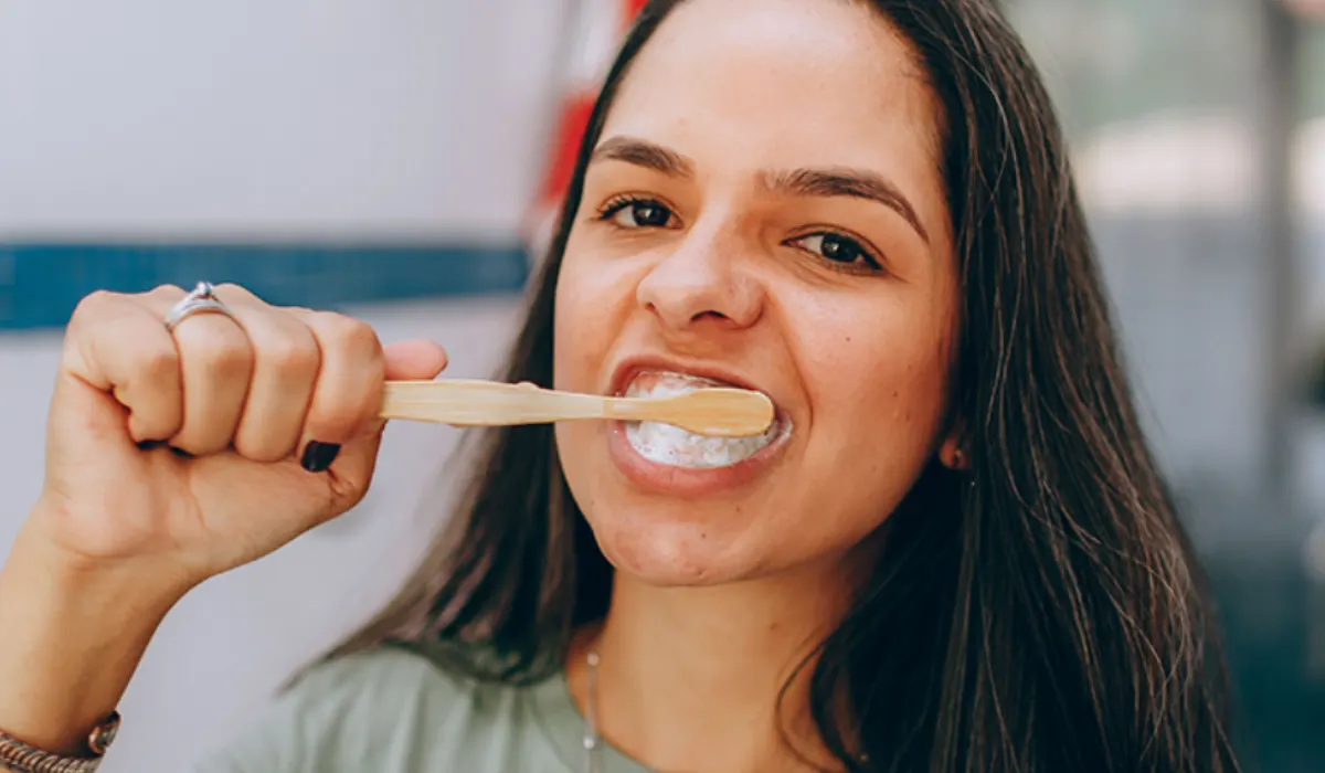 a women brushing her teeth