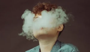 image shows a person while vaping